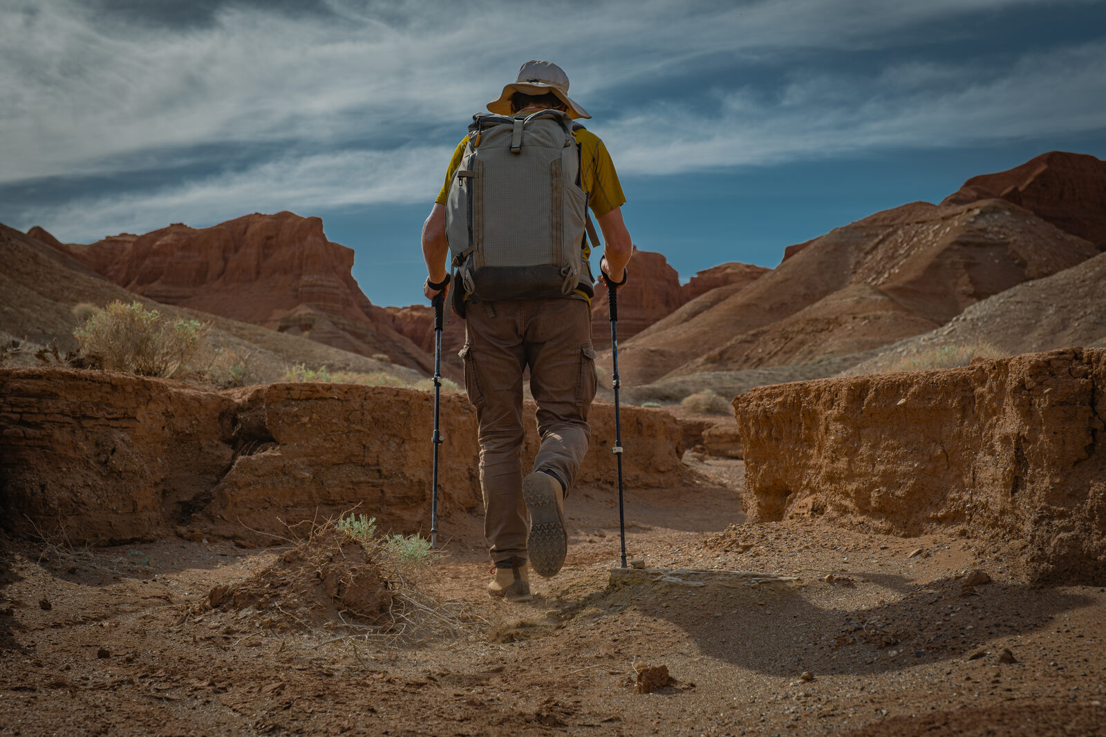 Hiker in a hot desert canyon